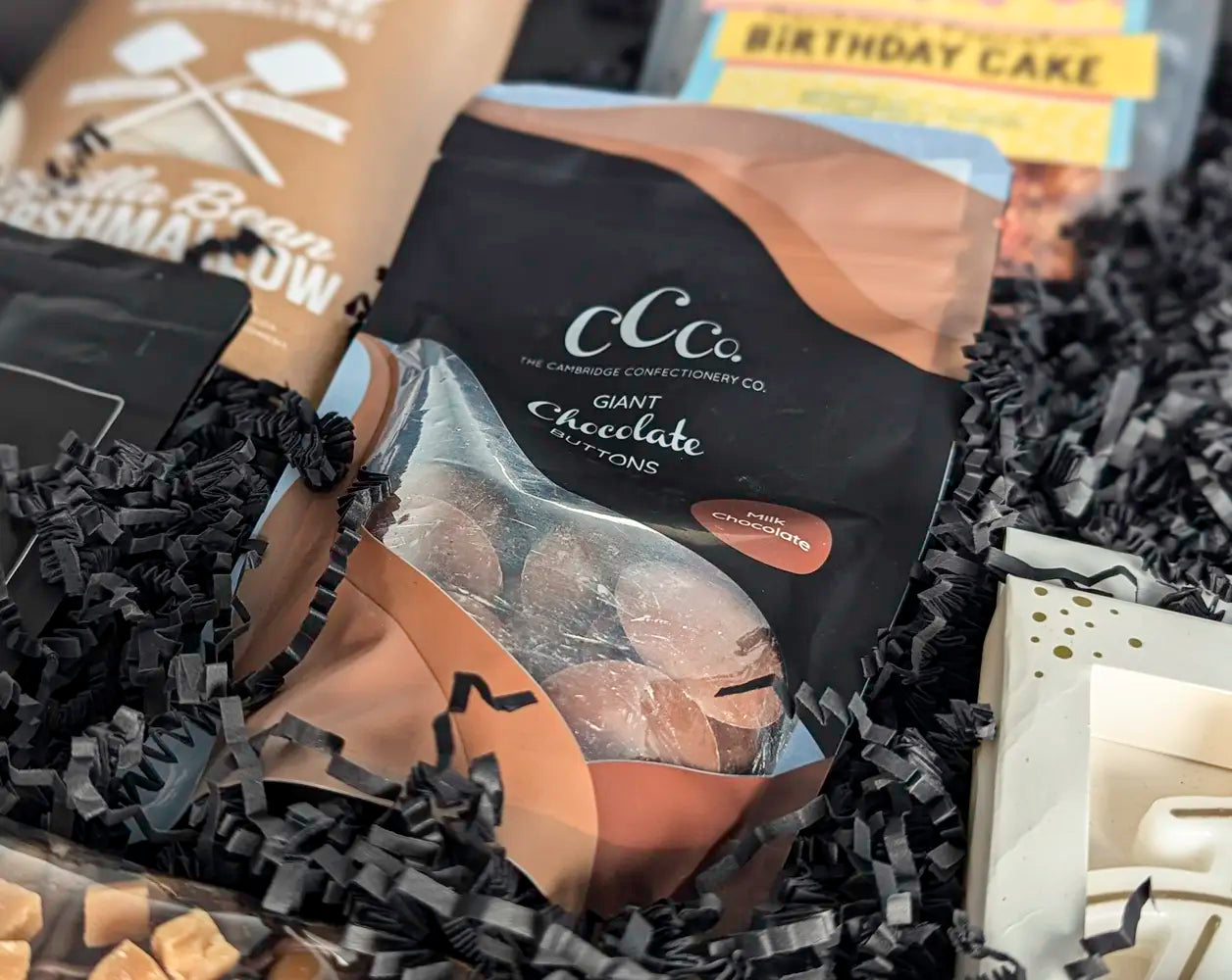 Chocolate product packaging with visible branding on a textured surface