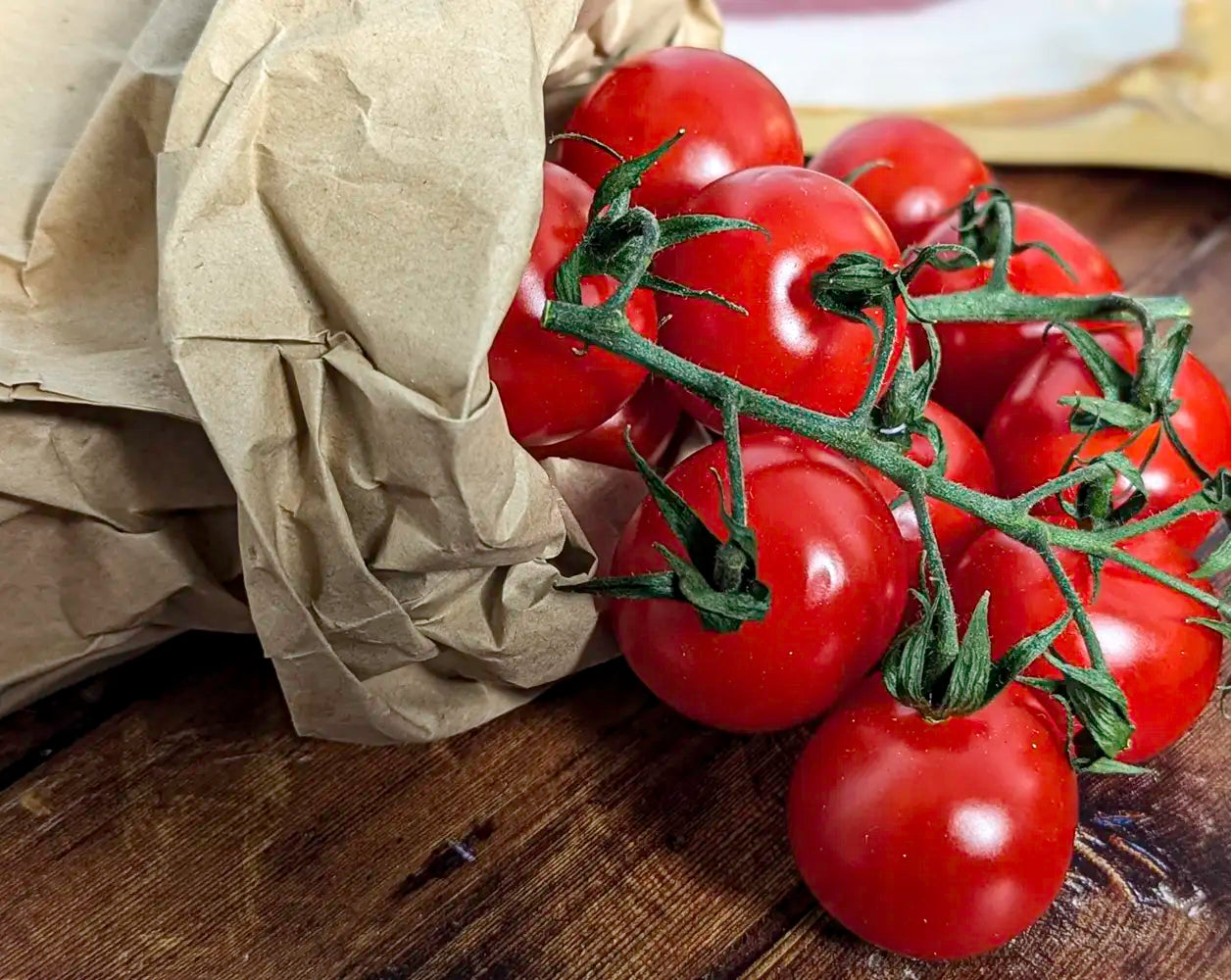 Cherry vine tomatoes on wooden background