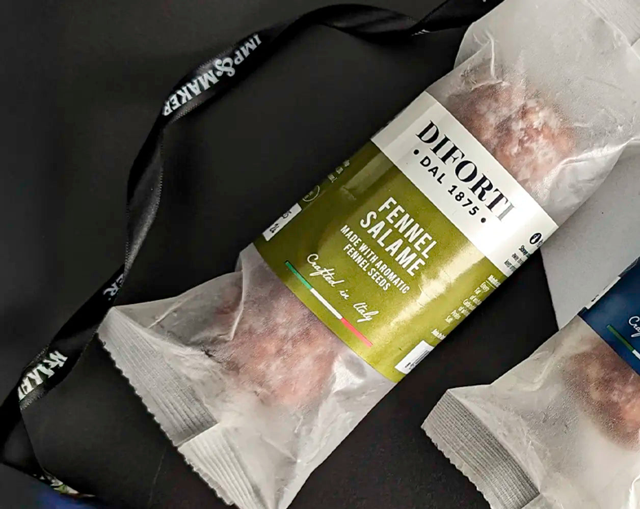 Diforti Salame with Fennel on a black background