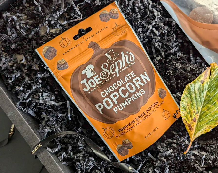 Joe Seph's Chocolate Popcorn Pumpkins in a gift box with decorative elements.