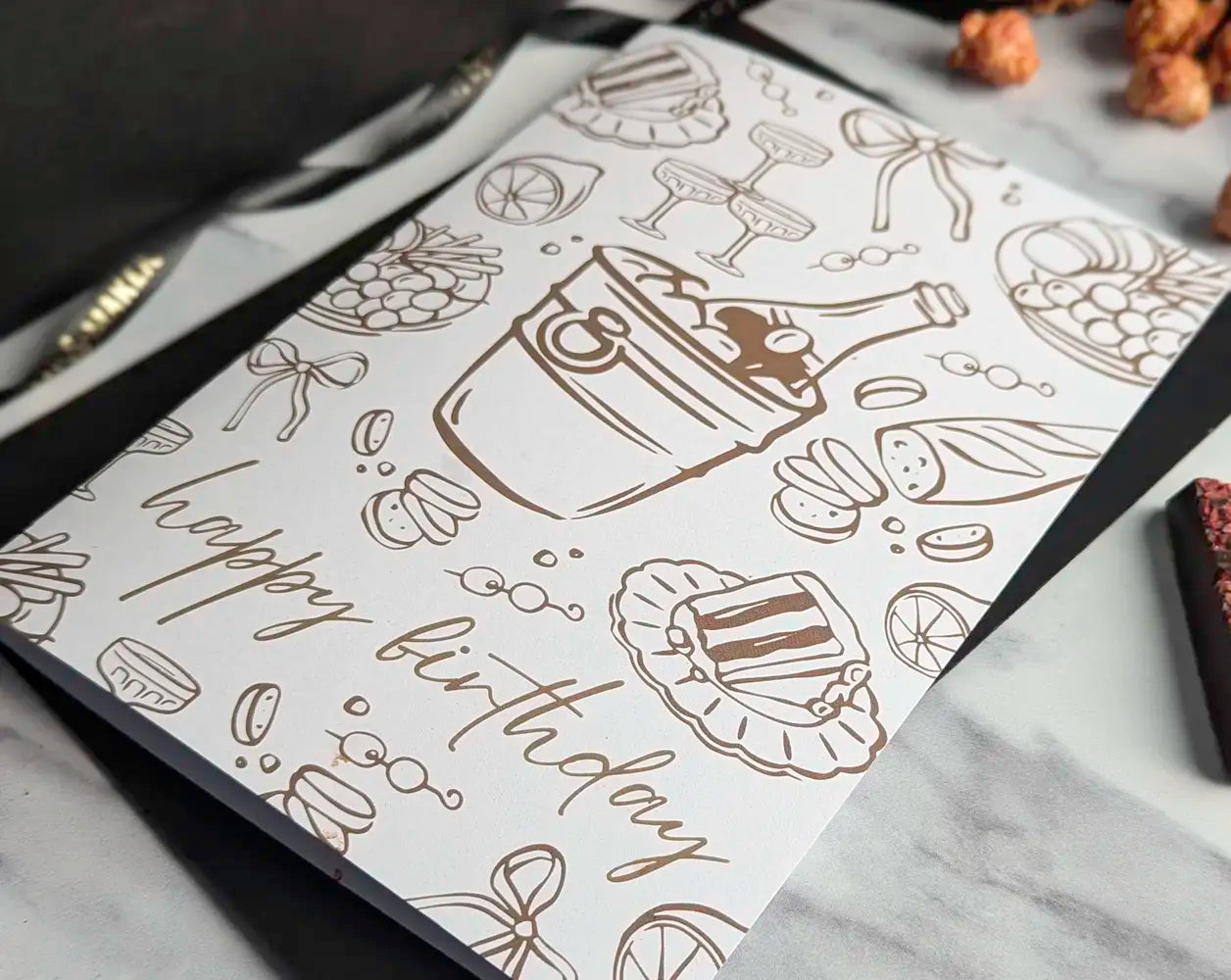 Greeting card with birthday design on a marble surface