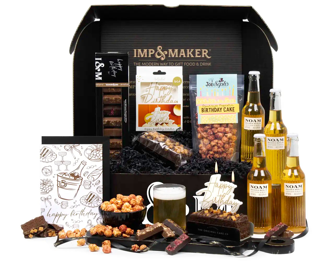 Gift basket with beer, snacks, and a birthday cake package from Imp & Maker.