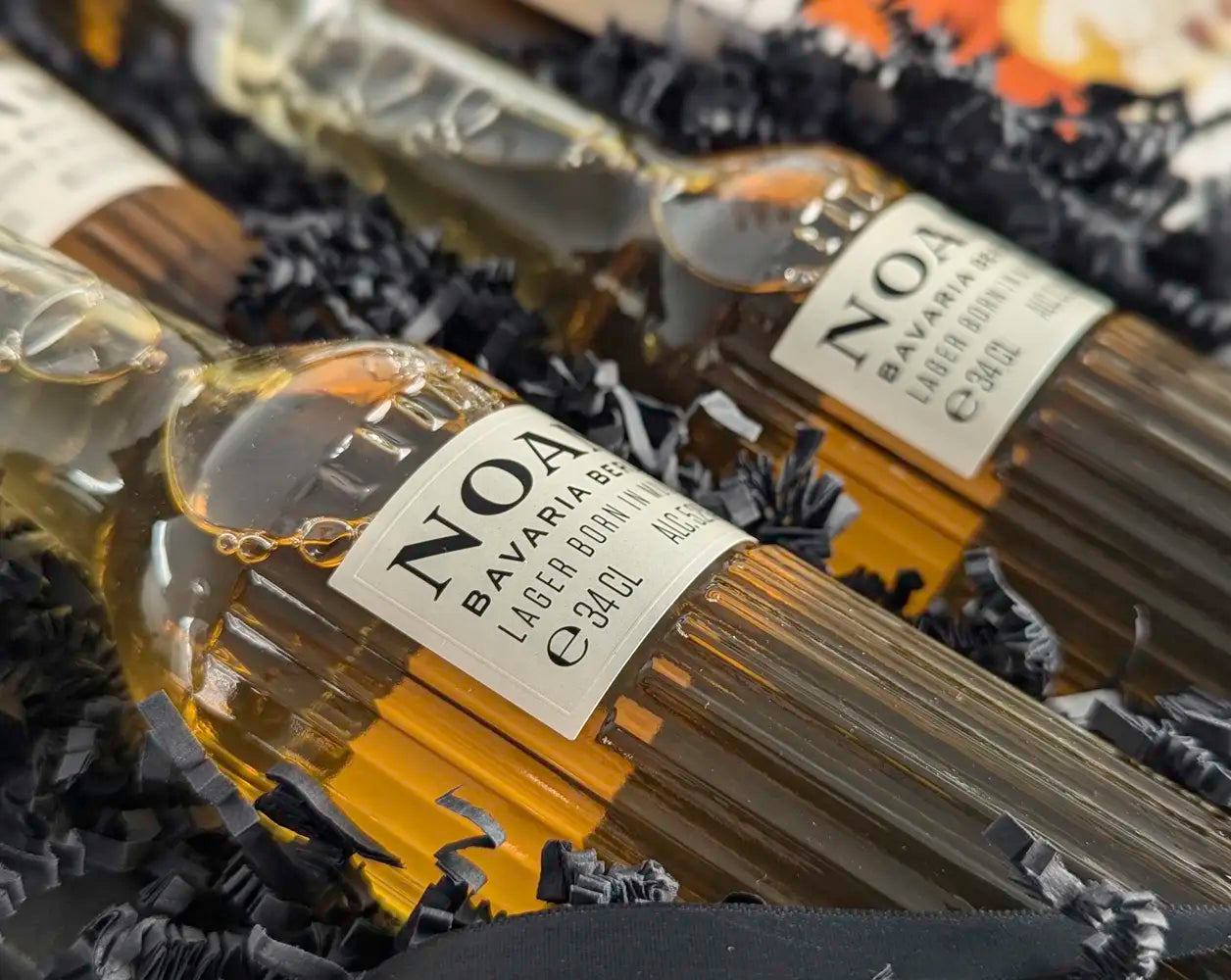 Bottle of NOAM Bavaria beer with a label on a textured surface